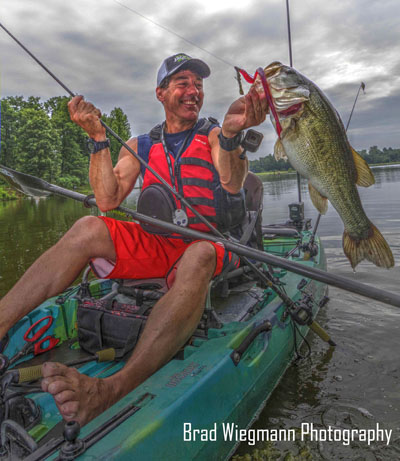 Eric Jackson catching a bass